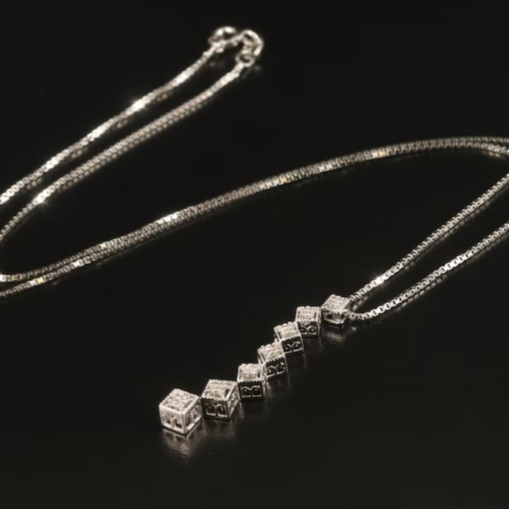 10k white gold and diamond journey pendant